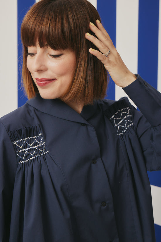 54-1 Wide blouse with smocking embroidery