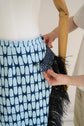 28-5 ANGLED Asymmetrical skirt with (button) tab and optional feather trim