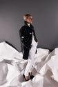 64-8 Patent leather coat with cut sleeves and press stud placket